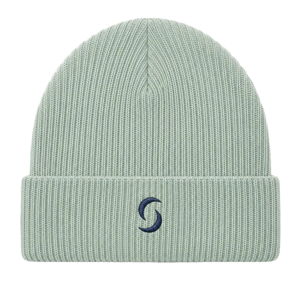 A sage green beanie against a white background with the