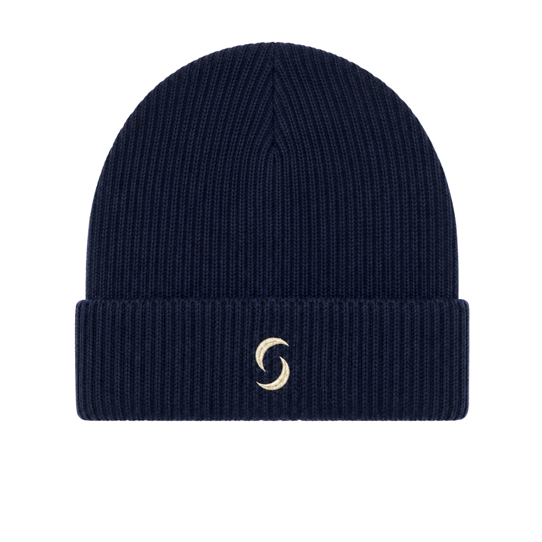 A navy blue beanie against a white background with the