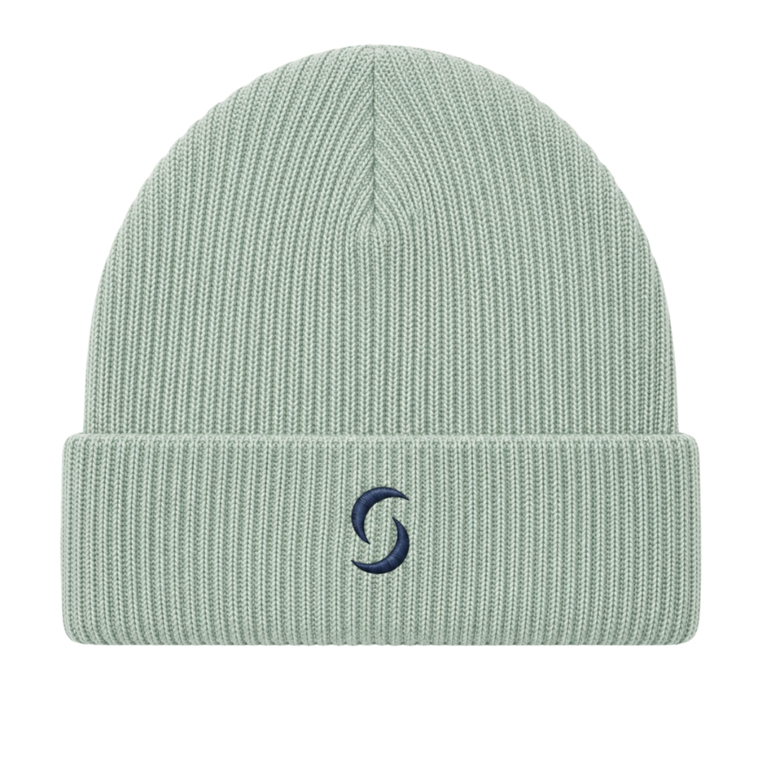 A sage green beanie against a white background with the 