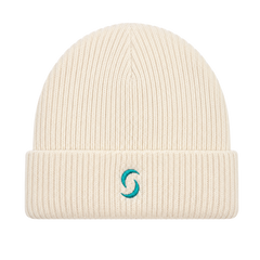 A beige beanie against a white background with the "saltie" on the front.