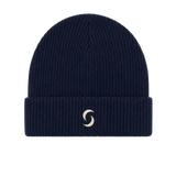 A navy blue beanie against a white background with the "saltie" logo on the front.