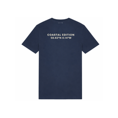 A branded saltie T-shirt against a white background. The main colour is a deep navy. The logo is placed on the back which reads "coastal editions", in the colour beige.
