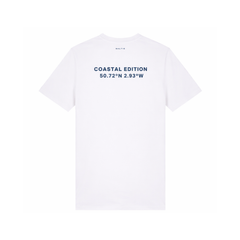 A branded saltie T-shirt against a white background. The main colour is white, the logo is placed on the back of the shirt that reads "coastal edition" in a navy colour.