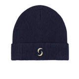 A branded saltie beanie against a white background. The main colour deep navy blue. The "s" saltie logo in a beige.