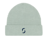 A branded saltie beanie against a white background. the "s" saltie logo in a navy whilst the main beanie colour is a green.