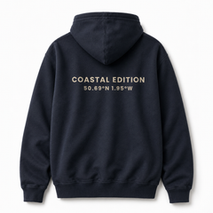 navy blue hoodie against a white background with "coastal editions" on the back of it.