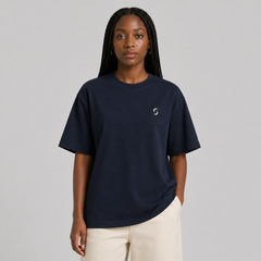Person wearing a navy blue T-shirt with a small "saltie" logo on it.